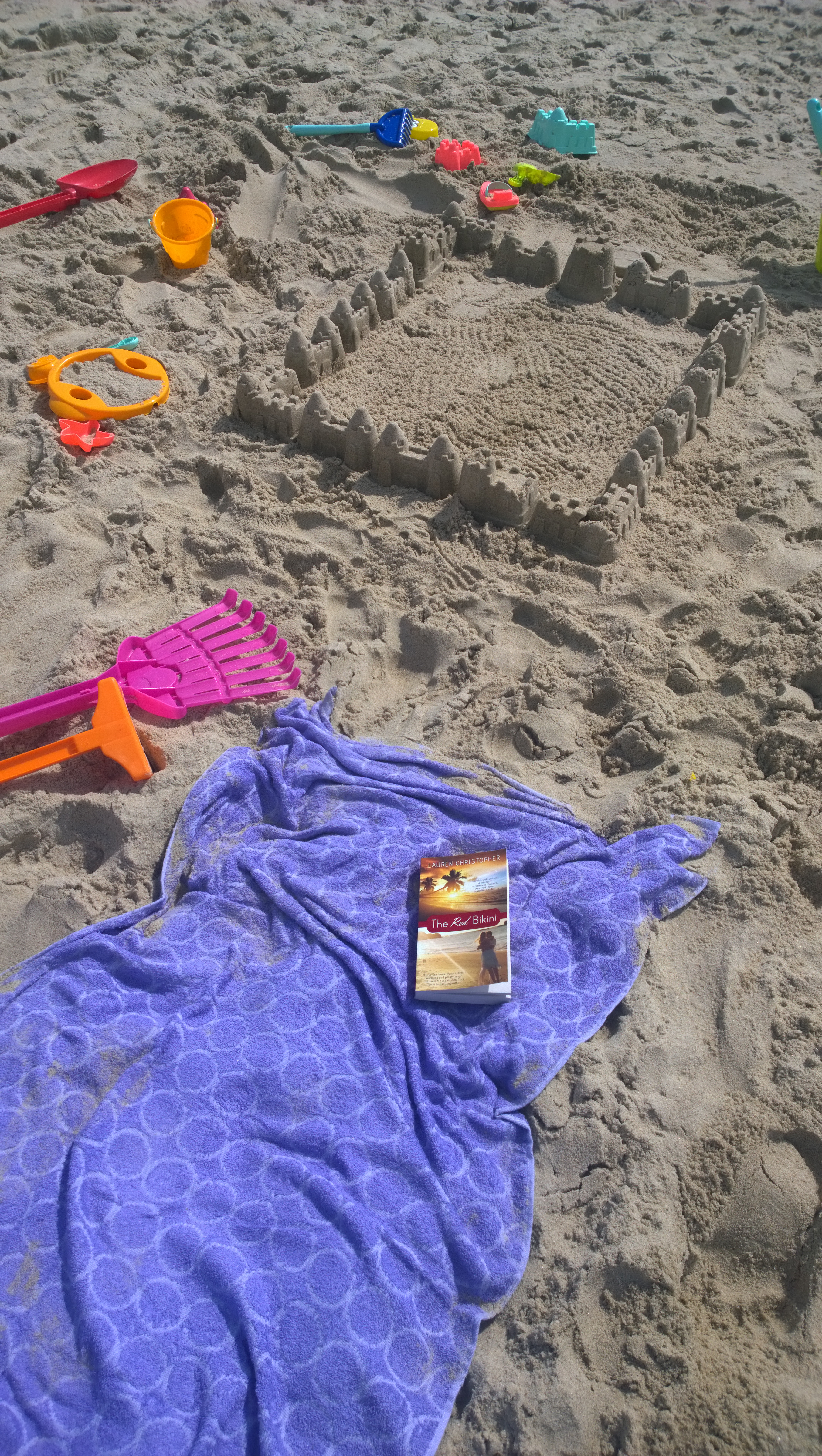 Debby B. With Her Kids At The Beach: She Reads While They Play!